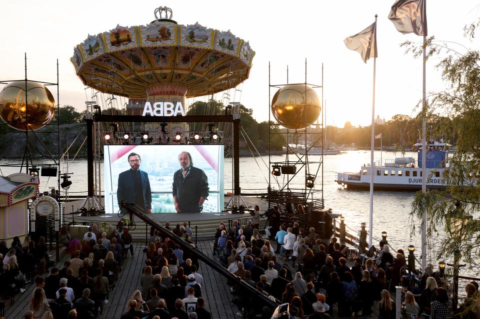 ABBA&#39;s Bjoern Ulvaeus and Benny Andersson are seen live on a display from London during their Voyage event at Grona Lund, Stockholm, on Sept. 2, 2021.T (Photo: Fredrik Persson/TT News Agency/AFP via Getty Images)