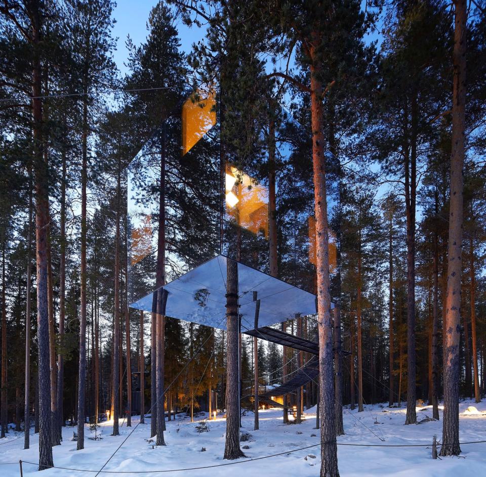 Mirrorcube Tree hotel is nearly invisible in the trees.