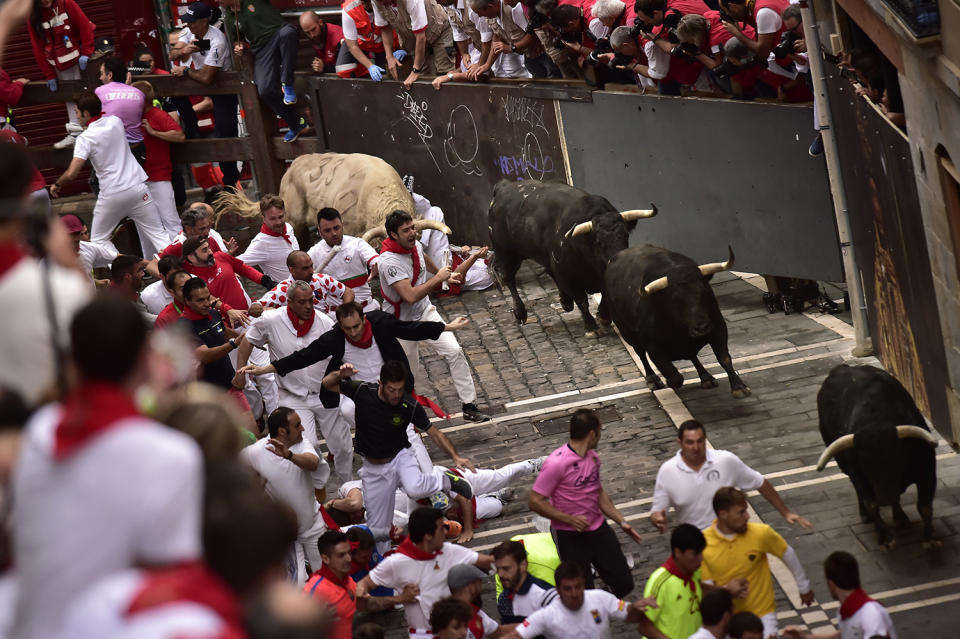 <p>Revellers run in front of Jandilla’s fighting bulls during the running of the bulls at the San Fermin Festival, in Pamplona, northern Spain, July 11, 2017. (AP Photo/Alvaro Barrientos) </p>