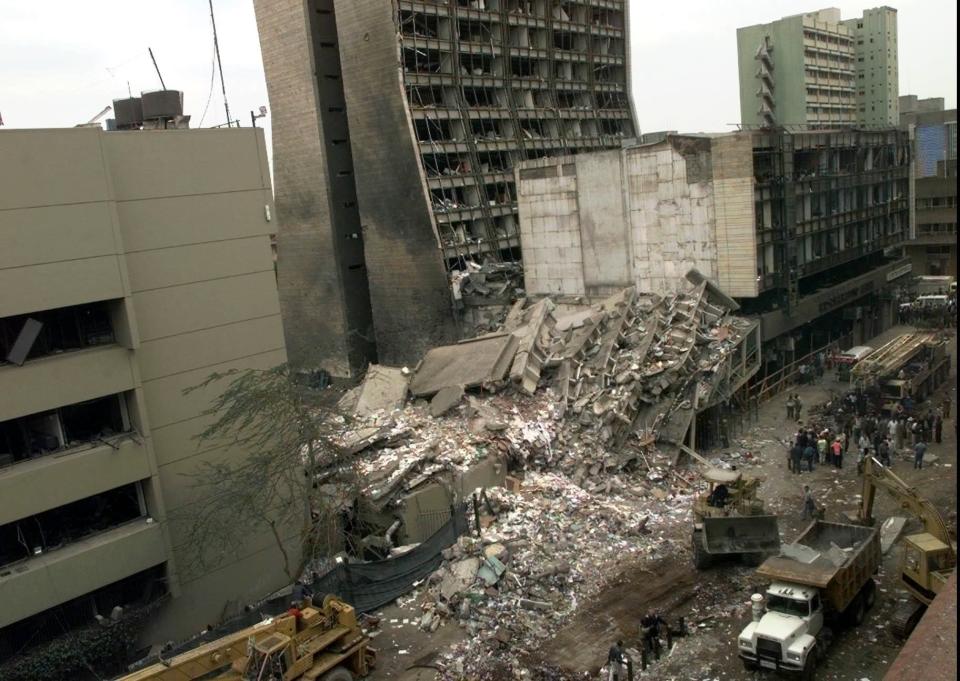 FILE - This Aug. 8, 1998, file photo shows the United States Embassy, left, and other damaged buildings in downtown Nairobi, Kenya, the day after terrorist bombs in Kenya and Dar es Salaam, Tanzania. The United States and Israel worked together to track and kill Abu Mohammed al-Masri, a senior al-Qaida operative in Iran earlier this year, a bold intelligence operation by the two allied nations that came as the Trump administration was ramping up pressure on Tehran. Al-Masri was gunned down in a Tehran alley on August 7, 2020 the anniversary of the 1998 bombings of the U.S. embassies in Nairobi, Kenya, and Dar es Salaam, Tanzania. Al-Masri was widely believed to have participated in the planning of those attacks and was wanted on terrorism charges by the FBI. (AP Photo/Dave Caulkin, File)