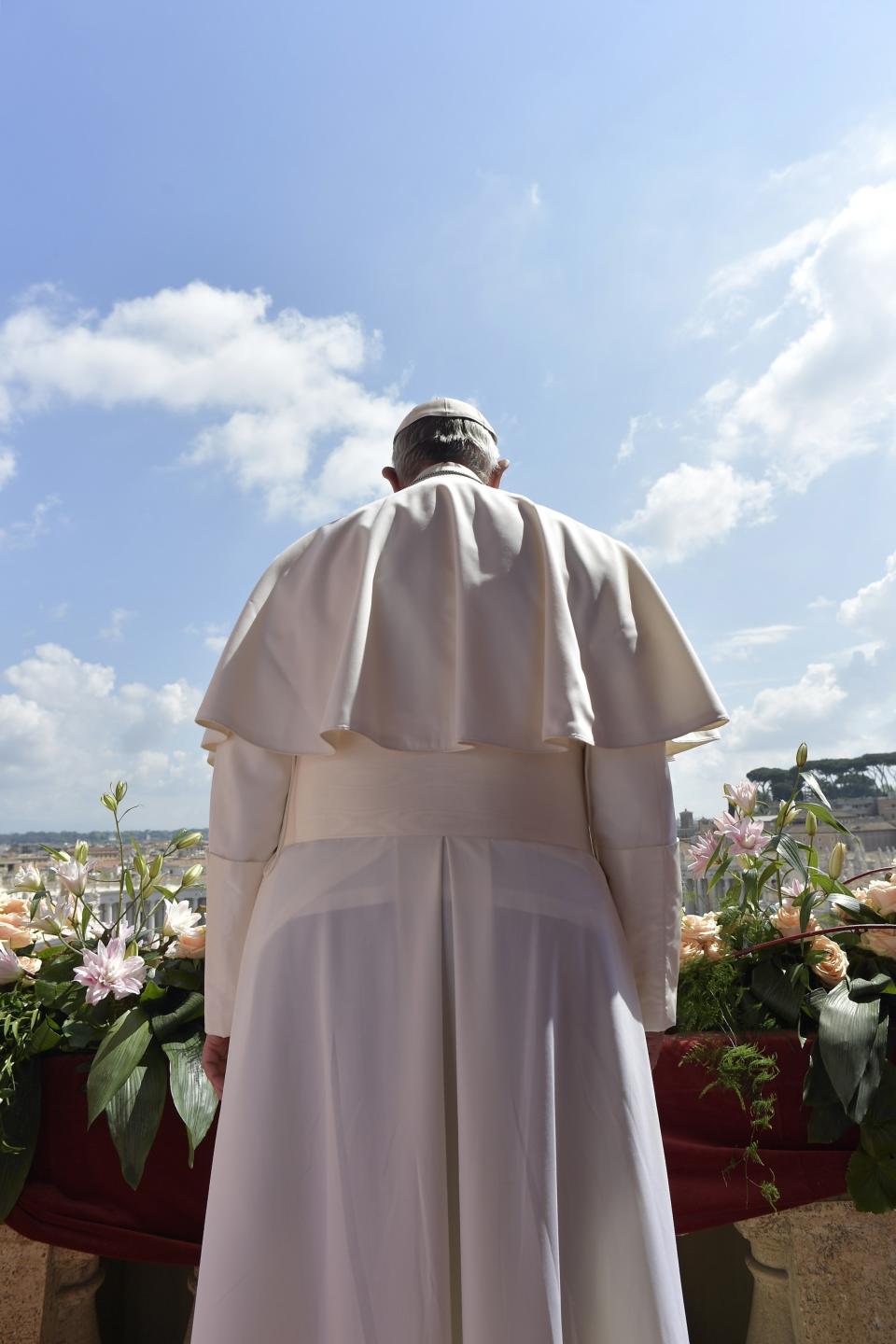 Pope Francis delivers his Urbi et Orbi (to the city and to the world) message from the main balcony of St. Peter's Basilica, at the Vatican, Sunday, April 16, 2017. (L'Osservatore Romano/Pool Photo via AP)