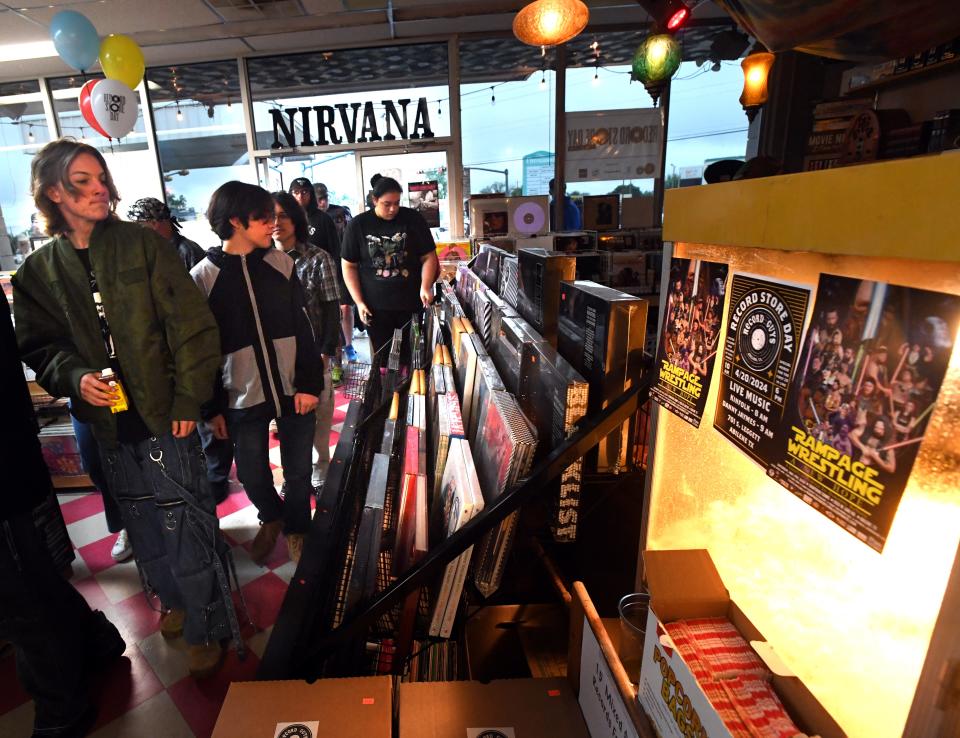 Customers enter The Record Guys after the doors opened on Record Store Day Saturday.