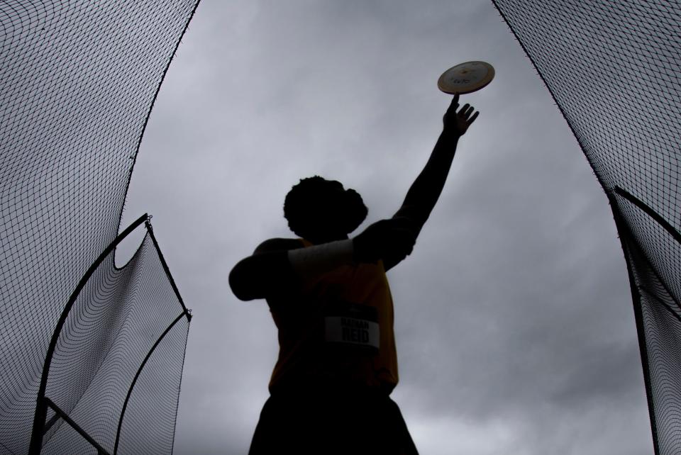 Wyoming's Nathan Reid tosses the discus before throwing in the men's discus on the third day of the NCAA Outdoor Track & Field Championships Friday, June 10, 2022 at Hayward Field in Eugene, Ore.