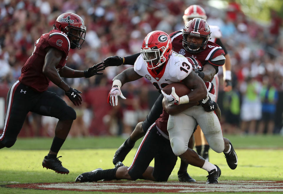 Elijah Holyfield was one of three Georgia backs to score. (Getty)