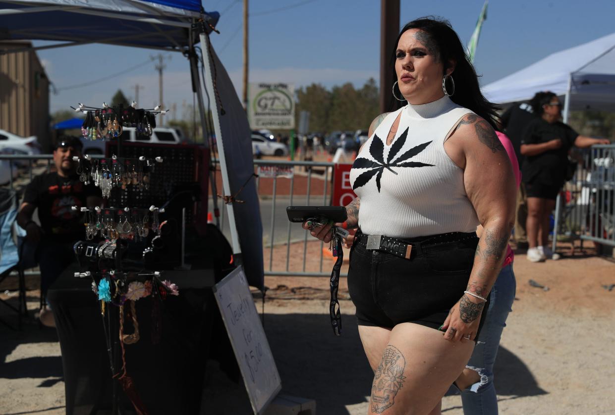 Spectators enjoy music, food, and cannabis-themed merchandise at the GT 420 Music Fest in Chaparral, New Mexico.