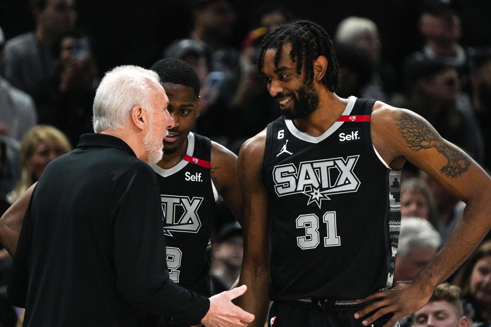 San Antonio Spurs head coach Gregg Popovich talks to forward Keita Bates-Diop (31) on the sideline during the game against the Minnesota Timberwolves at the Moody Center on Saturday, April 8, 2023 in Austin.