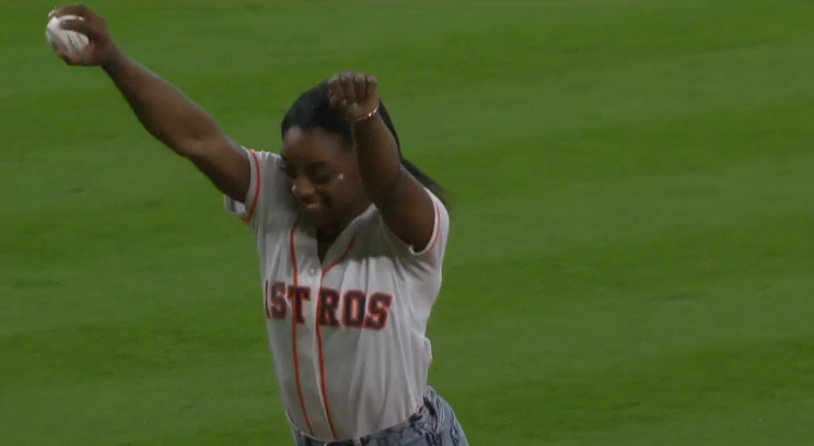 Simone Biles throws out an acrobatic first pitch at the Astros-Mariners game on July 4, 2016.