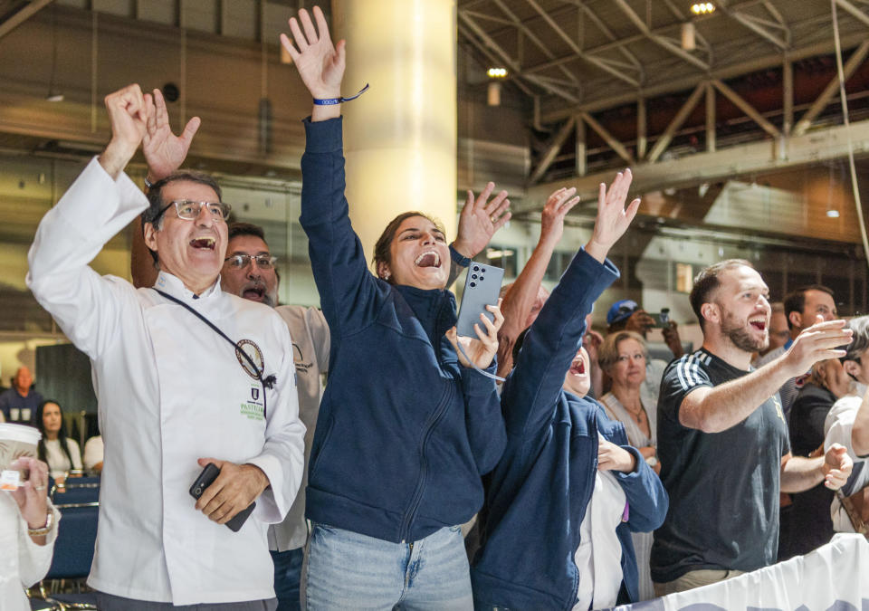 Onlookers cheer for their country during the Coupe de Monde de la Patisserie, or World Pastry Cup, at the Ernest N. Morial Convention Center in New Orleans, Tuesday, June 11, 2024. (Matthew Perschall/The Times-Picayune/The New Orleans Advocate via AP)