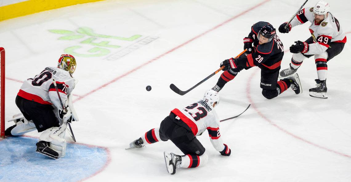 The Carolina Hurricanes Sebastian Aho (20) shoots on the Ottawa Senators goalie Joonas Korpisalo (70) in the third period on Wednesday, October 11, 2023 at PNC Arena, in Raleigh N.C. Robert Willett/rwillett@newsobserver.com