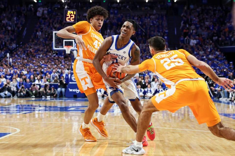 Kentucky guard Rob Dillingham (0) drives to the basket against Tennessee guard Cameron Carr (43) and Santiago Vescovi during Saturday’s game at Rupp Arena.