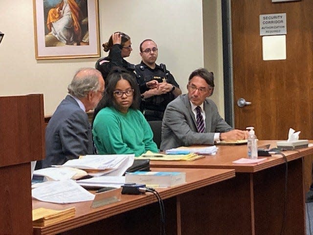 Yokauri Batista-Alcantara, joined by her attorneys Steven and Joshua Altman, awaits her sentencing Wednesday before Middlesex County Superior Court Judge Benjamin Bucca.