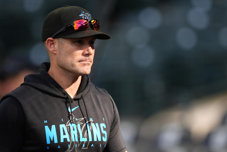 Miami Marlins manager Skip Schumaker (45) warms up before a Wednesday, August 28, 2024 baseball game in Denver. (AP Photo/David Zalubowski)