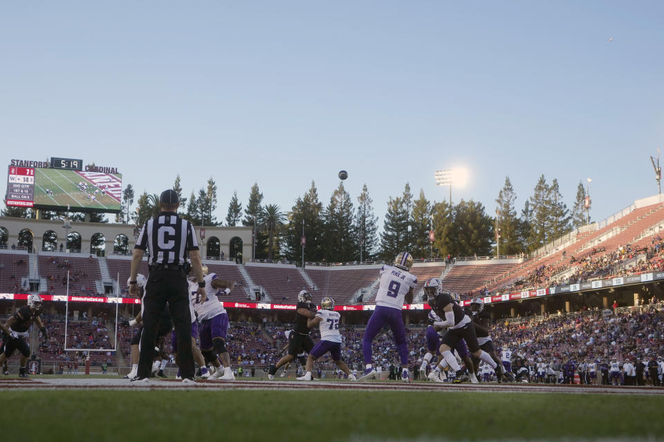 Washington quarterback Michael Penix Jr. (9) throws a 92-yard touchdown pass to wide receiver Ja'Lynn Polk against Stanford during the first half of an NCAA college football game in Stanford, Calif., Saturday, Oct. 28, 2023. (AP Photo/Jeff Chiu)