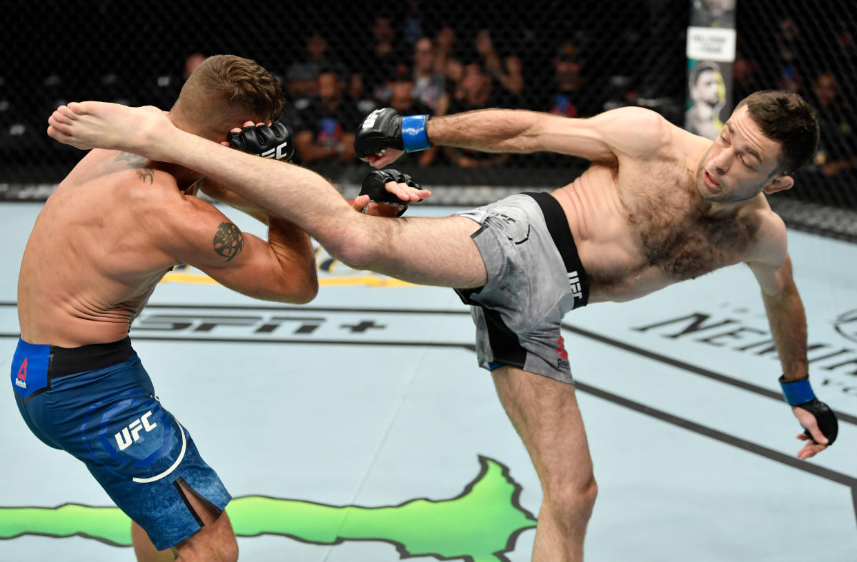 SACRAMENTO, CALIFORNIA - JULY 13:  (R-L) Ryan Hall kicks Darren Elkins in their featherweight bout during the UFC Fight Night event at Golden 1 Center on July 13, 2019 in Sacramento, California. (Photo by Jeff Bottari/Zuffa LLC/Zuffa LLC via Getty Images)