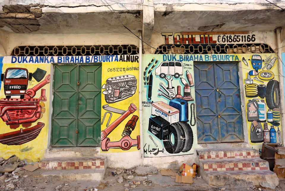 <p>A mural showing spare parts for vehicles is seen on a wall of a shop in Hodan district of Mogadishu, Somalia, June 10, 2017. (Photo: Feisal Omar/Reuters) </p>
