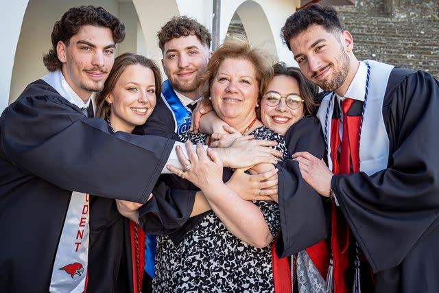 <p>Mike Peters for Montclair State University</p> The Povolo Quintuplets with their mother (center)