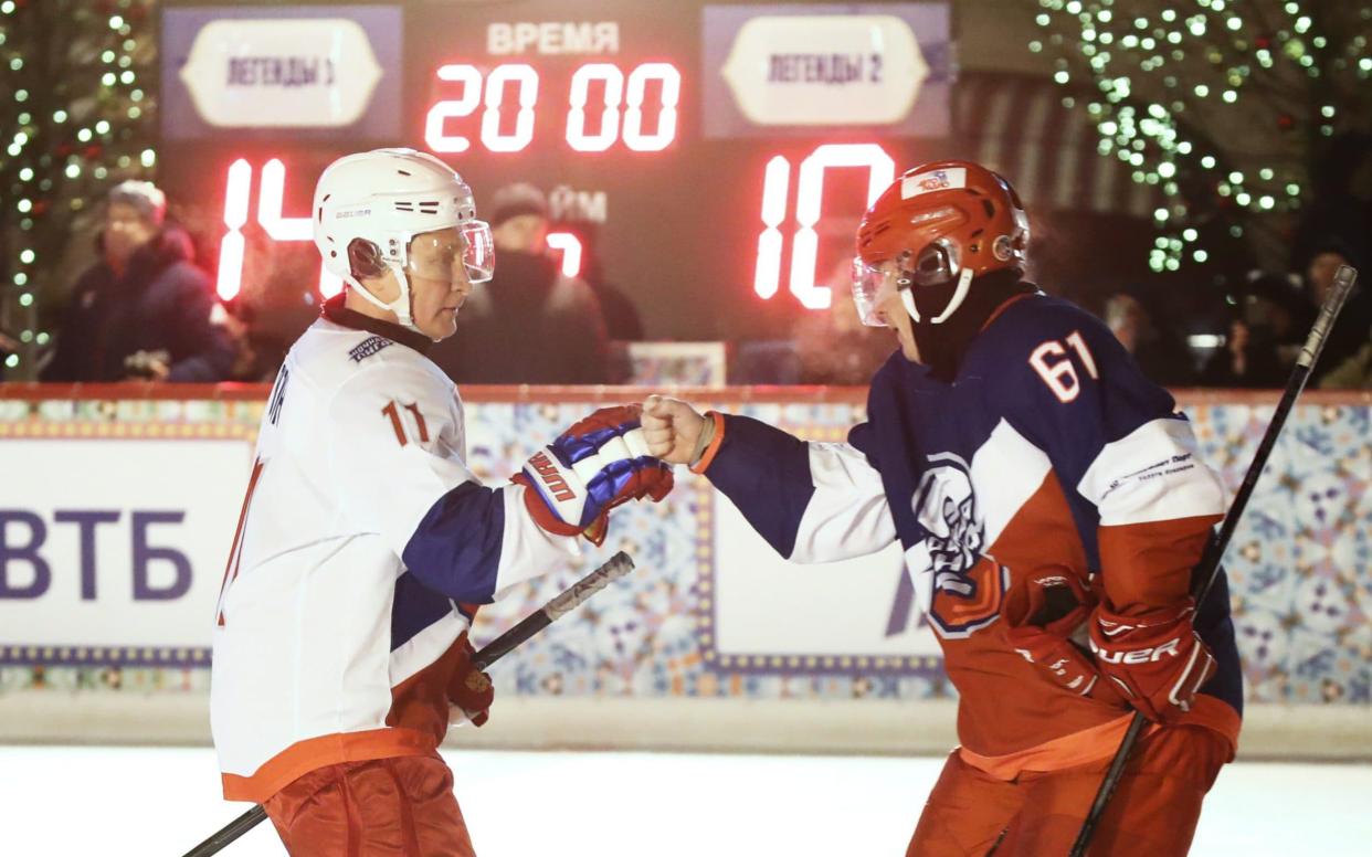 President of Russia Vladimir Putin (L) and Vladimir Potanin at an ice hockey friendly match - Valery Sharifulin /TASS