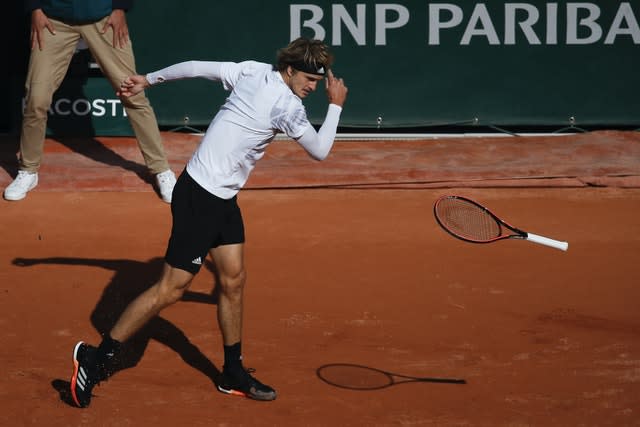 Alexander Zverev throws his racket to the ground during his loss to Jannik Sinner