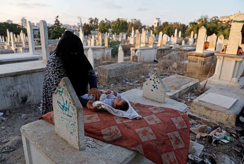 The Wider Image: Gaza struggles to accommodate the living and the dead as population grows