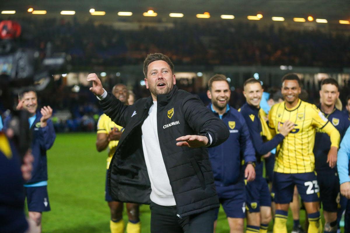 Oxford United head coach Des Buckingham celebrates with the away support in the second leg <i>(Image: Simon Hall)</i>