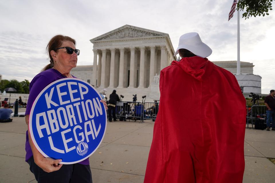 The Supreme Court is seen on the first day of the new term as activists demonstrate on the plaza, in Washington, Monday, Oct. 4, 2021.