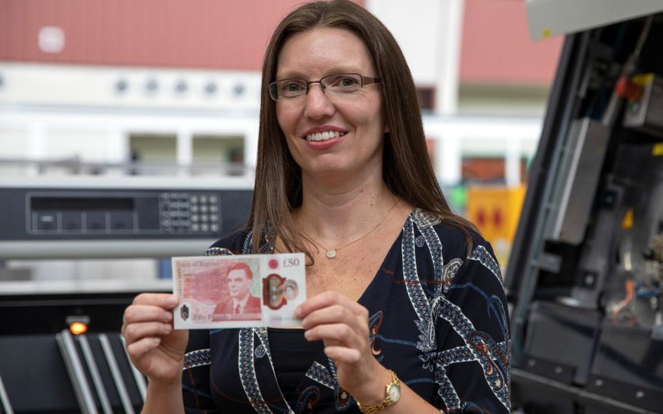 Sarah John with the polymer £50 banknote featuring Bletchley Park codebreaker and scientist Alan Turing