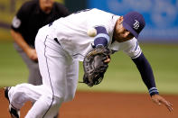 ST. PETERSBURG - JUNE 16: First baseman Carlos Pena #23 of the Tampa Bay Rays cannot come up with this throw against the Miami Marlins during the game at Tropicana Field on June 16, 2012 in St. Petersburg, Florida. (Photo by J. Meric/Getty Images)