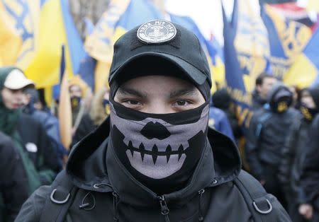 Activists of nationalist groups and their supporters take part in the so-called March of Dignity, marking the third anniversary of the 2014 Ukrainian pro-European Union (EU) mass protests, in Kiev, Ukraine, February 22, 2017. REUTERS/Valentyn Ogirenko