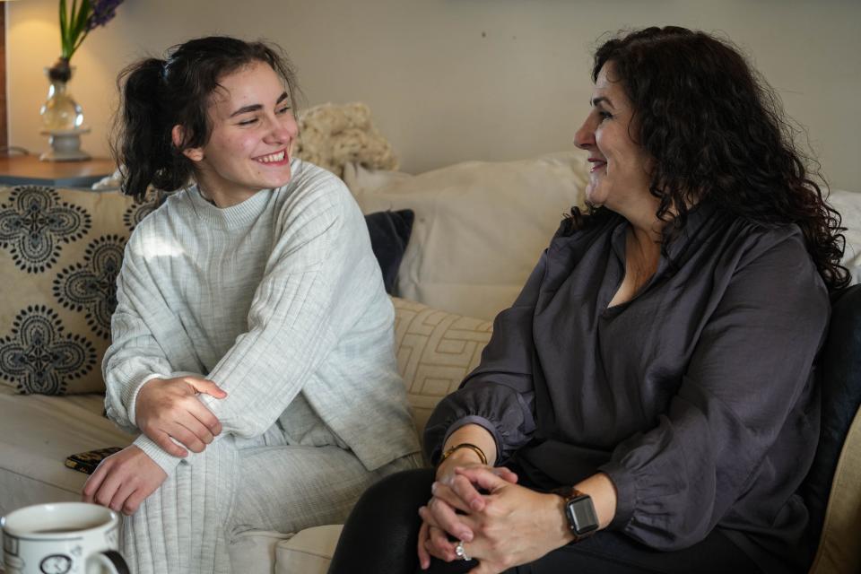 Maure Thompson is one of seven children adopted by Colleen Thompson, right, and her husband.