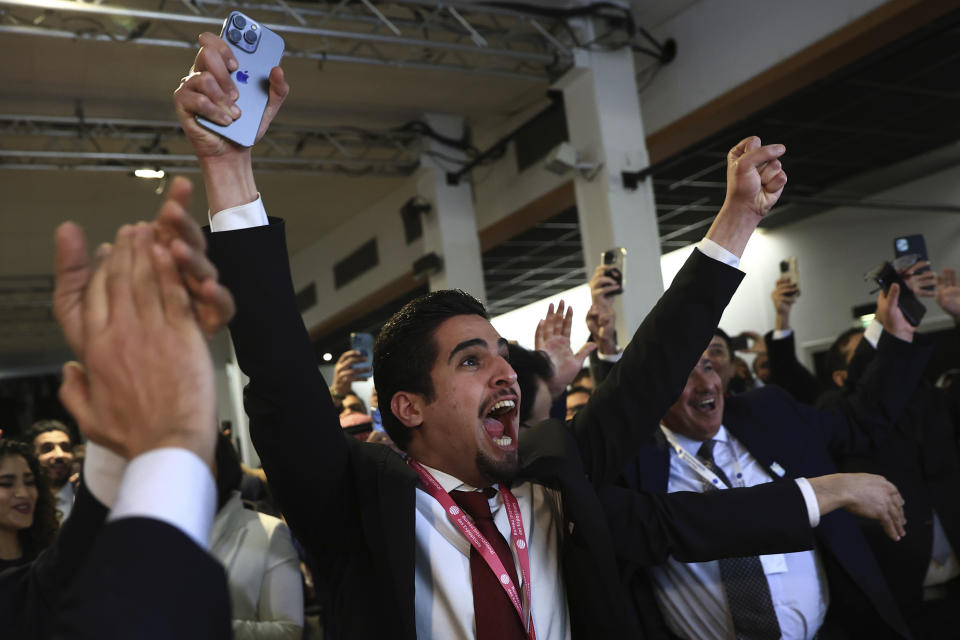 Members of the Saudi Arabia delegation react as the Bureau International des Expositions, or BIE, announces the vote Tuesday, Nov. 28, 2023 in Issy-les-Moulineaux, outside Paris. Saudi Arabia's capital Riyadh was chosen to host the 2030 World Expo, beating out South Korean port city Busan and Rome for an event expected to draw millions of visitors. Saudi Arabia's capital Riyadh was chosen on Tuesday to host the 2030 World Expo, beating out South Korean port city Busan and Rome for an event expected to draw millions of visitors. Riyadh was picked by a majority of 119 out of 165 votes by the member states. (AP Photo/Aurelien Morissard)