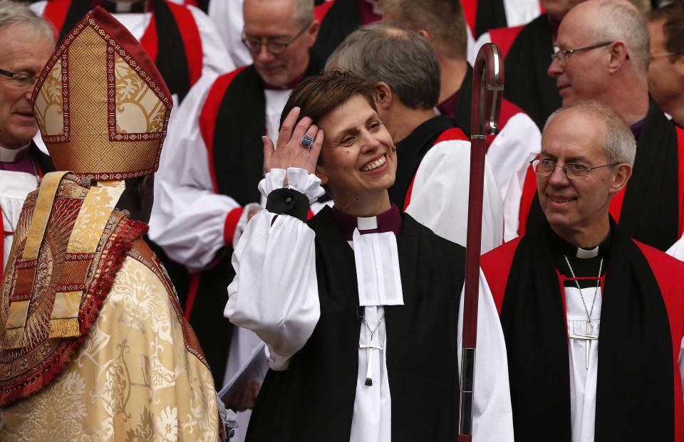 The first female bishop in the Church of England Libby Lane adjusts her hair following her consecration service at York Minster in York