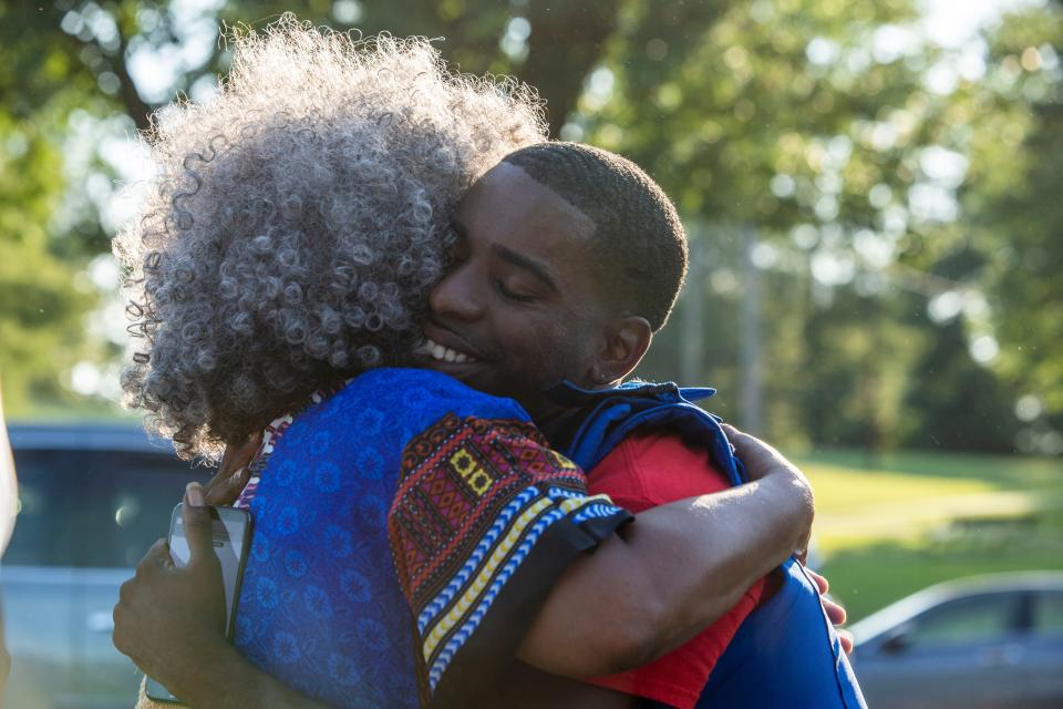 Winnette Bobo hugs and prays over Tracy Boyd during the Juneteeth celebration, hosted by The Society for African American Cultural Awareness at the T. R. White Sportsplex, Jackson, Tenn., Friday, June 19, 2020.