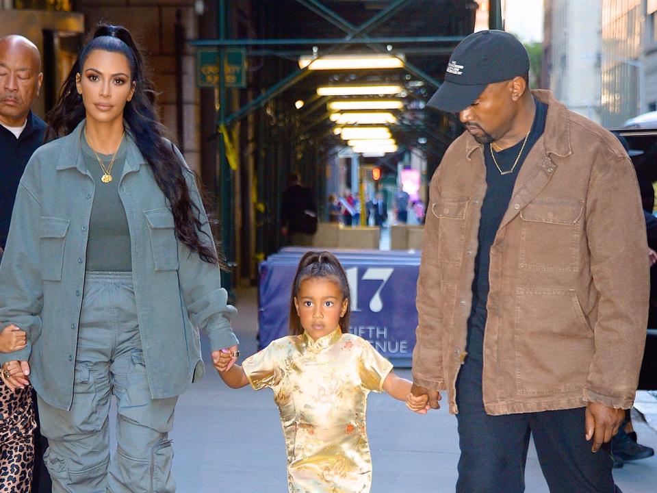 Kim Kardashian, Kanye West, and their daughter North West in 2018.