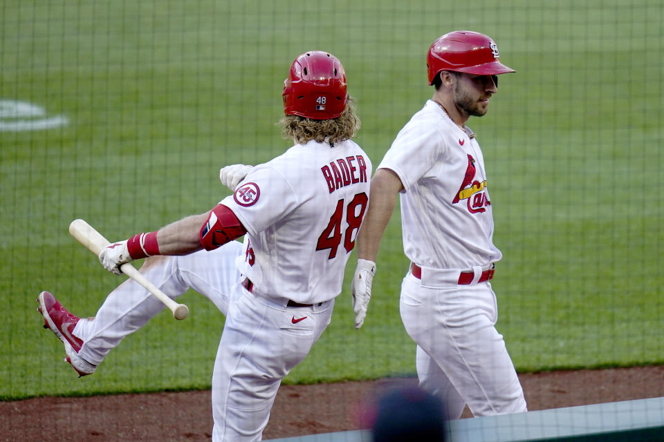 St. Louis Cardinals' Paul DeJong, right, is congratulated by teammate Harrison Bader (48) after hitting a two-run home run during the fifth inning in the first game of a baseball doubleheader against the New York Mets Wednesday, May 5, 2021, in St. Louis. (AP Photo/Jeff Roberson)