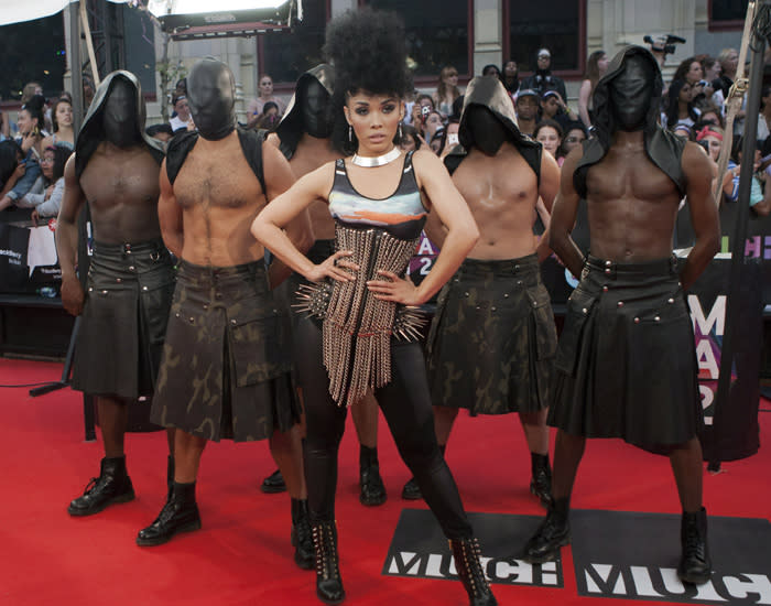 It's hard to focus on singer Kreesha Turner when her scary backup dancers are taking away all our attention. Seriously, what is with those masks?? Turner looks almost as intimidating with her spiked outfit.  THE CANADIAN PRESS/Chris Young