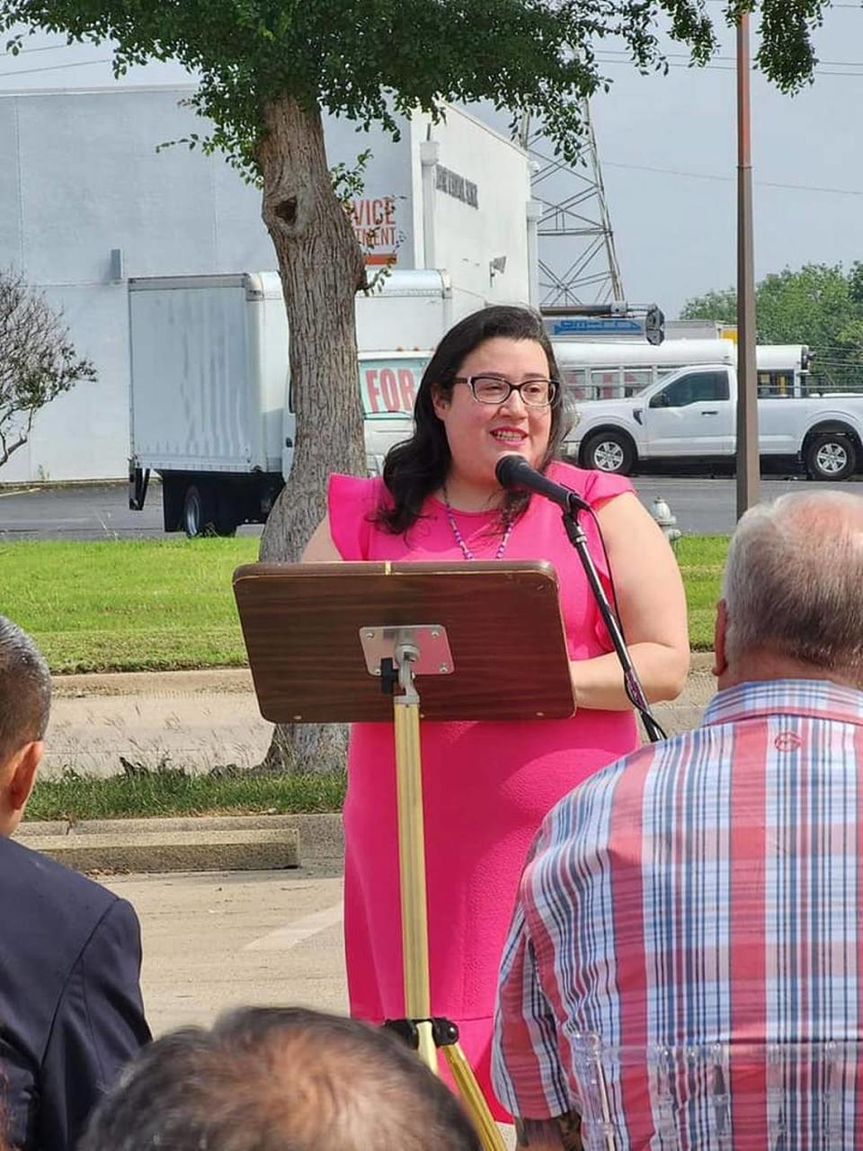 Amanda Arizola speaks about the significance of the Dolores Huerta street topper on May 27.