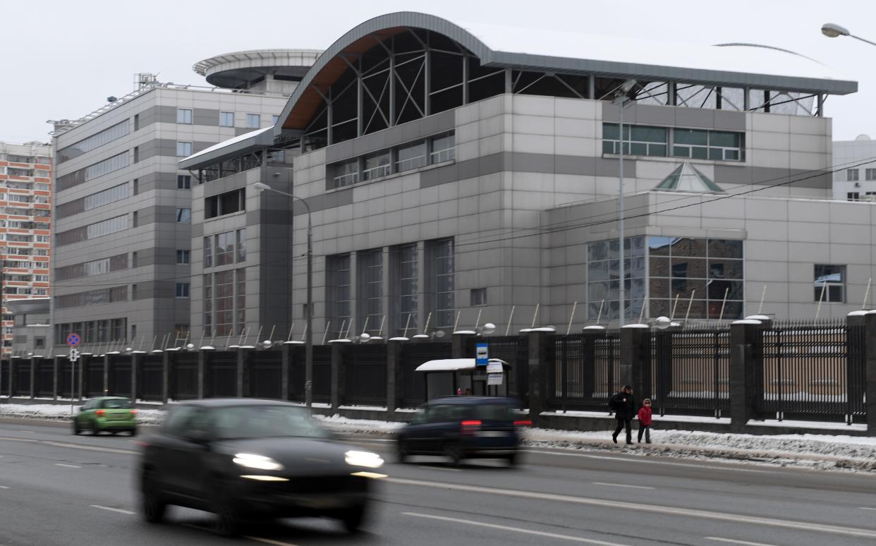 <p>Cars drive past the headquarters of the Russian General Staff's Main Intelligence Department (GRU) in Moscow on December 30, 2016</p> (AFP via Getty Images)