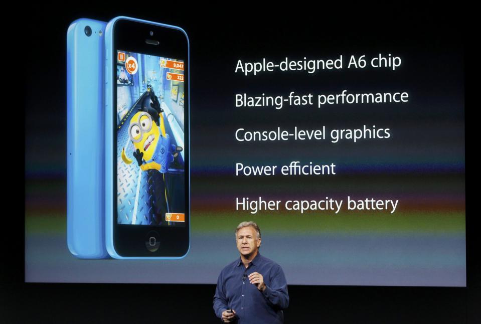 Phil Schiller, senior vice president of worldwide marketing for Apple Inc, talks about the features of the new iPhone 5C at Apple Inc's media event in Cupertino, California September 10, 2013. REUTERS/Stephen Lam (UNITED STATES - Tags: BUSINESS SCIENCE TECHNOLOGY BUSINESS TELECOMS)