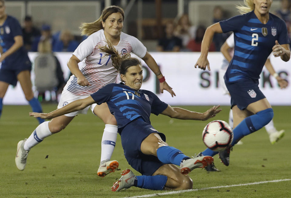 United States' Tobin Heath, bottom, scores a goal in front of Chile's Geraldine Leyton during the first half of an international friendly soccer match in San Jose, Calif., Tuesday, Sept. 4, 2018. (AP Photo/Jeff Chiu)