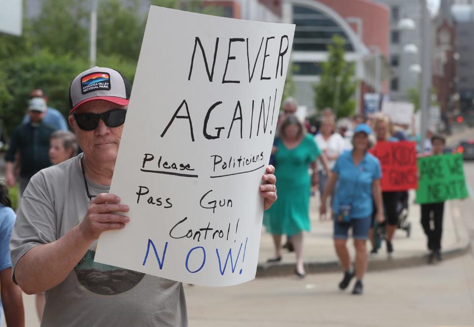 Rick Bohan of Akron takes part in the Walk for Our Lives against gun violence Wednesday in Akron.