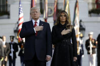 <p>President Trump and first lady Melania Trump stand for a moment of silence to mark the anniversary of the Sept. 11 terrorist attacks, on the South Lawn of the White House, Monday, Sept. 11, 2017, in Washington. (Photo: Evan Vucci/AP) </p>