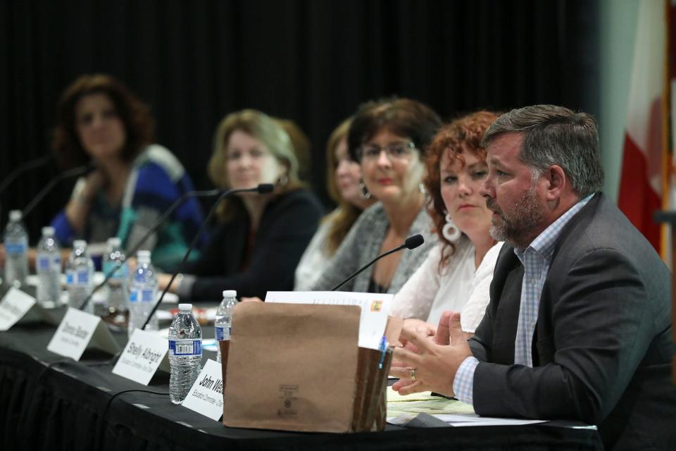 Education Committee Chair John Webber (right) speaks during Wellington's Public Safety and Education Committee Joint Meeting in the Wellington Community Center's Grande Ballroom Wednesday, March 28, 2018.