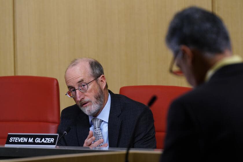 Democratic state Sen. Steve Glazer questions Democratic state Sen. Anthony Portantino about his measure requiring parents to tell school officials if they keep guns in the house during a hearing of the Senate Education Committee in Sacramento, Calif., Wednesday, March 30, 2022. Glazer voted in favor of the bill but it failed passage in its first legislative committee. (AP Photo/Rich Pedroncelli)