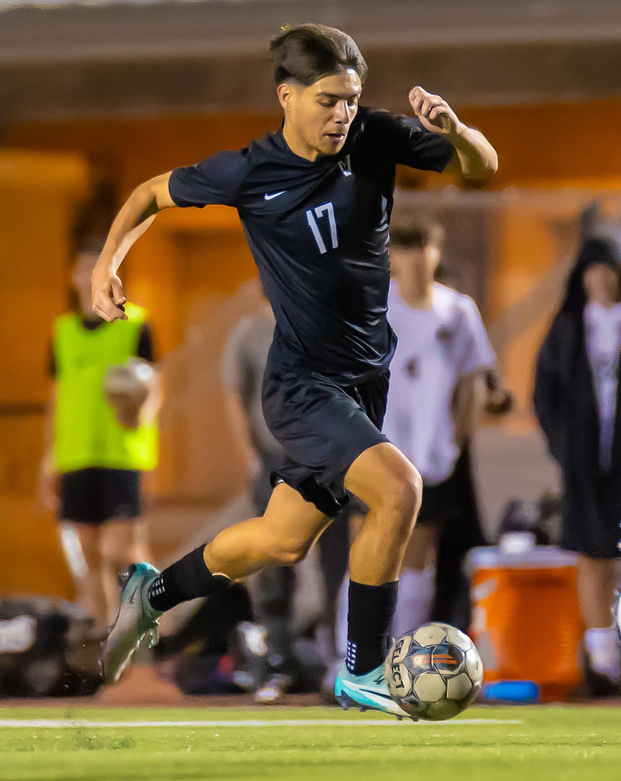 Vandegrift's Yandel Andrade dribbles the ball during the Vipers' District 25-6A match against Round Rock on Jan. 30.