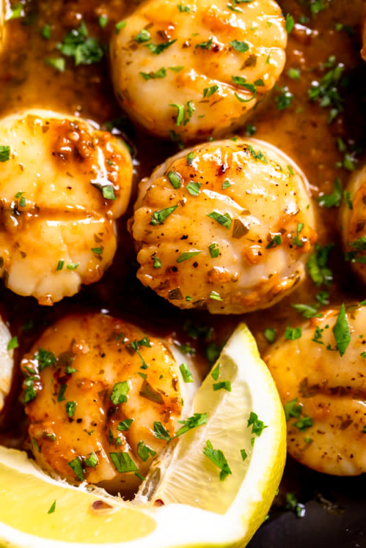 <p>Fox and Briar</p><p>Sweet, buttery and delicate sea scallops are quickly seared in a hot pan, then a simple lemon, butter and garlic sauce is made in the same pan. Served on their own or over pasta, these seared scallops are perfect for date night at home.</p><p><strong>Get the recipe: <a href="https://www.foxandbriar.com/lemon-butter-scallops-recipe/" rel="nofollow noopener" target="_blank" data-ylk="slk:Lemon Butter Scallops;elm:context_link;itc:0;sec:content-canvas" class="link ">Lemon Butter Scallops</a></strong></p>