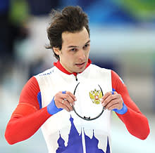 Dmitry Lobkov of Russia reacts after a malfunction with the starters pistol during the men's speed skating 1,000 m finals