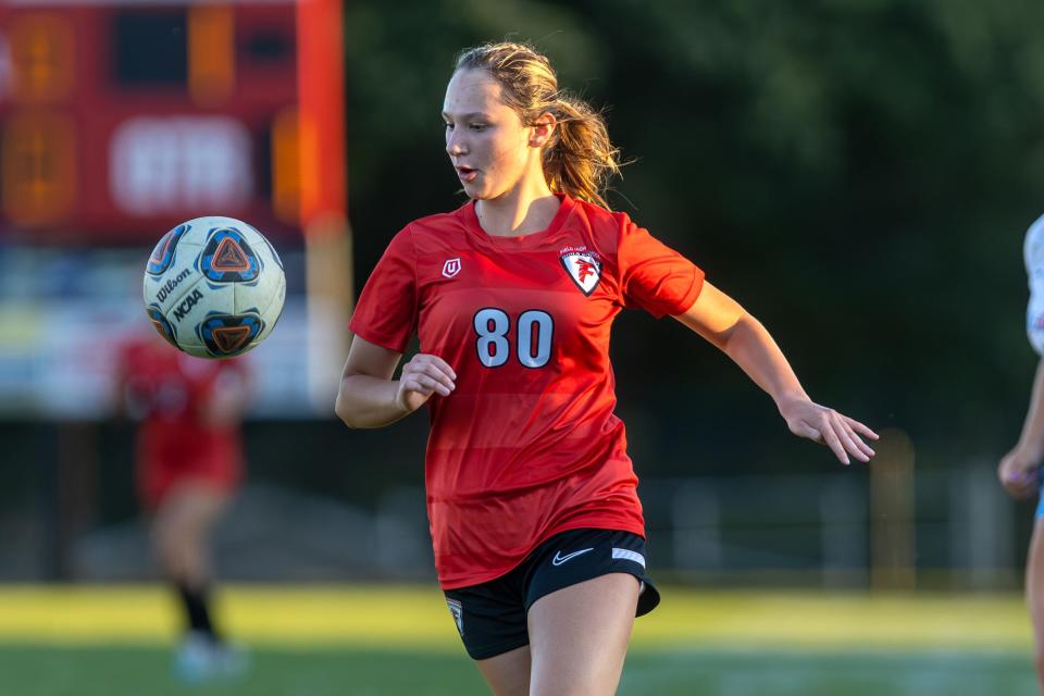 Field senior Adriana Bright runs with the ball during Thursday night’s soccer match against the Alliance Aviators at Field High School.