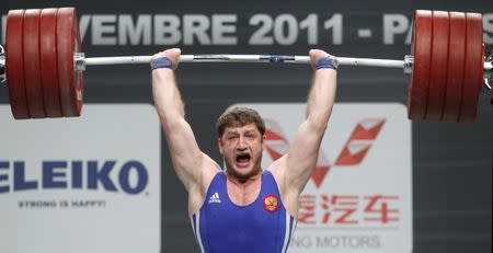 FILE PHOTO: Khadzhimurat Akkaev of Russia competes in the men's 105kg weightlifting competition during the World Weightlifting Championships at Disney Village in Marne-la-Vallee outside Paris, November 12, 2011. REUTERS/Benoit Tessier