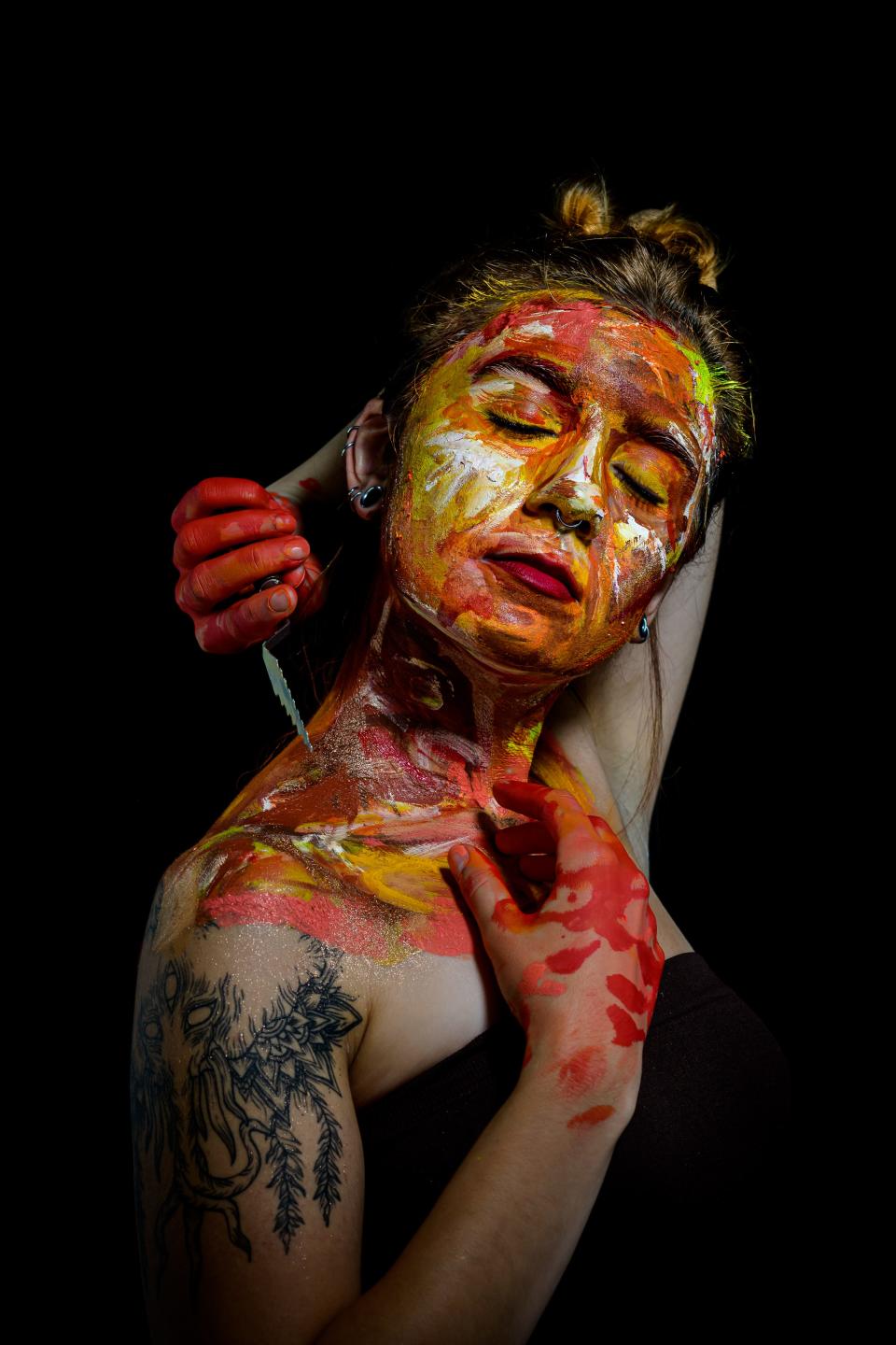 Heidi Fawver is shown covered with paint in a portrait created by Stark County photographer David Dingwell. Dingwell will present this piece and other portraits as part of the "Coalescence" exhibition with fellow artist Melissa Goff on Friday at Patina Arts Centre in downtown Canton.