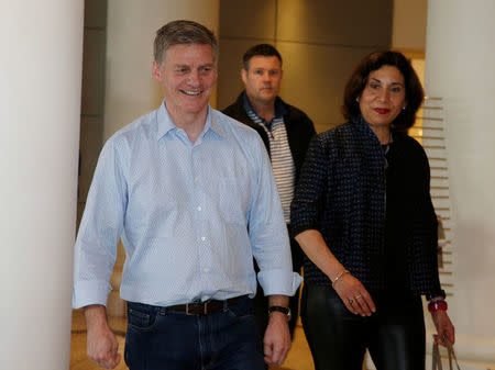 New Zealand Prime Minister Bill English arrives to speak to the media alongside his wife Mary on general election day in Auckland, New Zealand, September 23, 2017. REUTERS/Nigel Marple